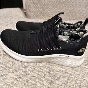Skechers Black Slip-On Sneakers with Daisy Print Lining